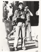 black and white photo of brown beret Joanne Salas at police brutality protest